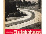 un vieux livre sur lequel figure l'image d'une voiture roulant sur une route