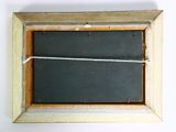 a chalk board with a string attached to it