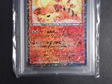 a close up of a pokemon card in a plastic case