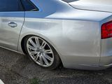 a silver car that is parked in a parking lot