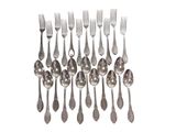 silver plated spoons and forks arranged in a row on a white background