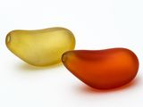 two pieces of glass sitting next to each other on a white surface
