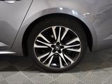 a close up of a car ' s wheel on the floor