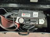 a suitcase that has a sander and a sanding machine in it