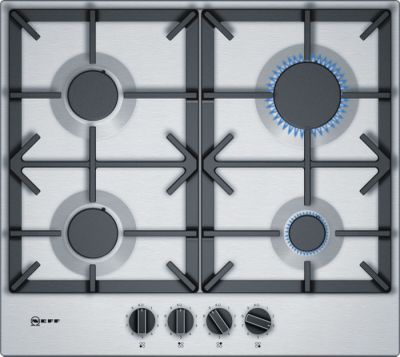 un gros plan sur une plaque de cuisson à gaz à quatre feux