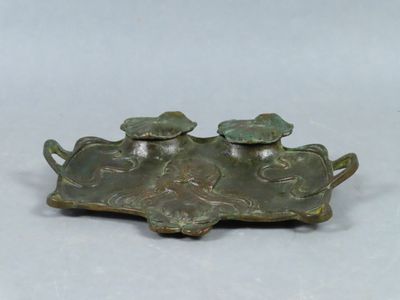 an image of a bronze figurine of two people on a boat