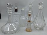 a lot of glass bottles that are sitting on a table