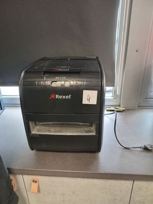 a paper shredder sitting on a counter in a kitchen