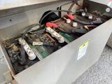 a metal box with a bunch of batteries inside of it