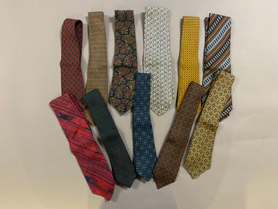 a lot of ties that are arranged together on a table