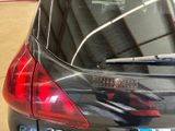 a picture of a car that has a sticker on the back of it