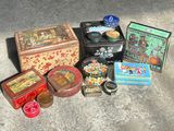 many different tins and tin cans sitting on the ground