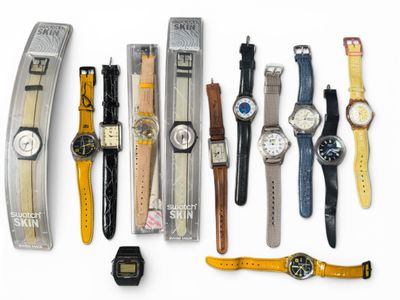 a lot of watches that are lined up on the table