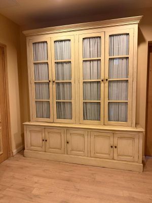 a large cabinet in the middle of a living room