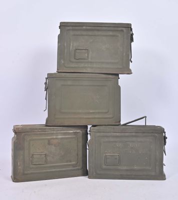 three gray boxes stacked on top of each other on a white surface
