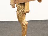 an image of a wooden table with a lion head on it