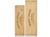 two wooden boxes with wine labels on them sitting next to each other