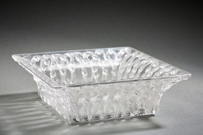 a glass bowl that is sitting on a table
