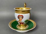 a close up of a cup and saucer on a saucer