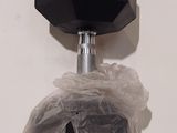 a plastic bag with a black object on top of it