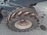 a tractor tire that is sitting on the ground