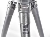 a silver tripod with a camera on top of it