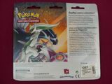 pokemon trading card with a picture of a white dragon on it