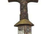 a small knife with a wooden handle on a white background