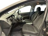 the interior of a car with the door open and the driver ' s seat down