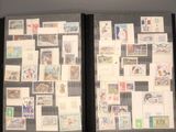 two black binders with stamps on them on a wall