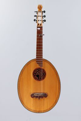 a close up of a guitar on a white background