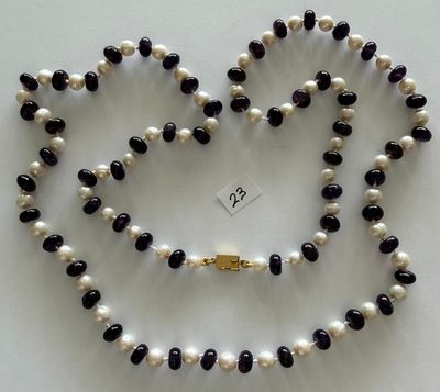 black and white pearl necklace with a gold clasp