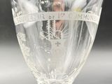 a wine glass that is sitting on a table