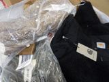 a pile of clothing that is sitting on a table