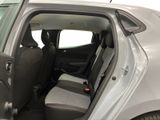 a car with the door open and the passenger seat down