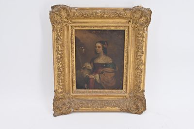 un tableau représentant une femme, dans un cadre doré, accroché au mur
