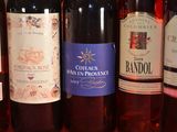several bottles of wine are lined up on a table