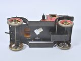 a small toy train with wheels on a white surface