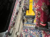 a vacuum that is sitting on a rug on the floor