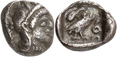 a silver coin with an image of a horse on it