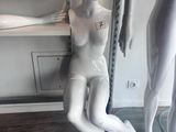 two mannequins that are sitting next to each other
