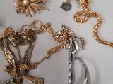 a lot of gold and silver jewelry on a table