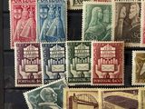 an image of a collection of stamps with a picture of a man and a woman