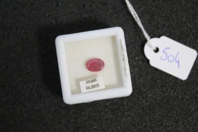 a small white box with a red ring inside of it