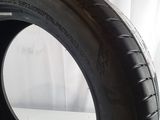 a close up of a tire on a white surface
