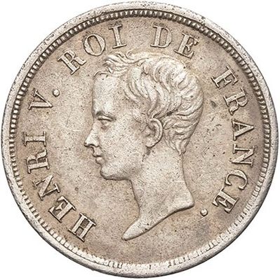 a silver coin with the head of a woman in profile