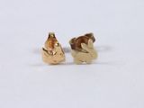 a small pair of earrings that are sitting on a white surface