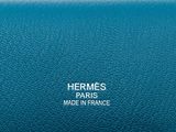 hermes made in france logo on a blue leather bag