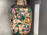 a vase that is sitting on a glass shelf