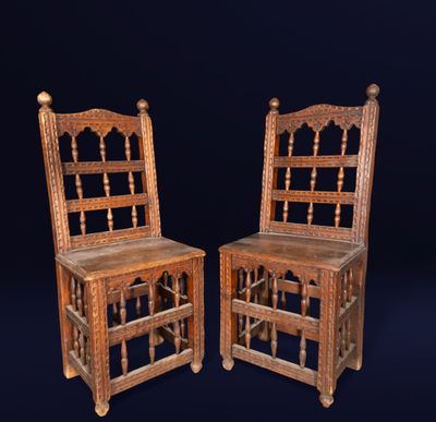 pair of antique wooden chairs with turned backs and turned legs